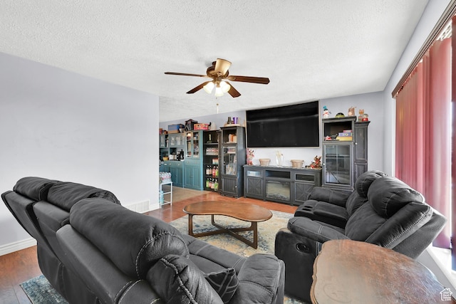 142 Green St, Layton, UT 84041 - living room with ceiling fan, a textured ceiling, and dark hardwood / wood-style flooring
