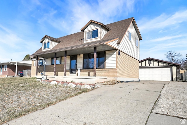 142 Green St, Layton, UT 84041 - view of front of property with a garage, covered porch, and an outbuilding