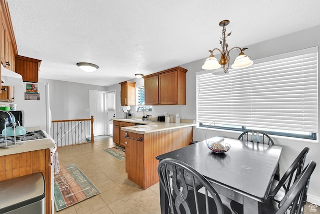 142 Green St, Layton, UT 84041 - kitchen with pendant lighting, sink, light tile patterned floors, an inviting chandelier, and white fridge