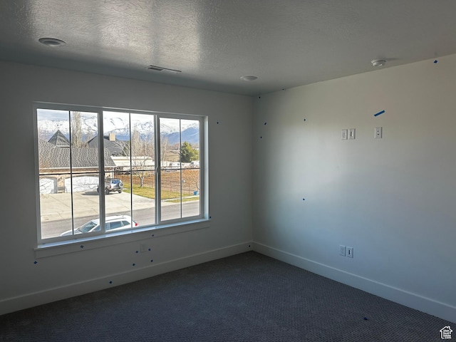 595 W 330 S, American Fork, UT 84003 - carpeted spare room with a textured ceiling, baseboards, and visible vents