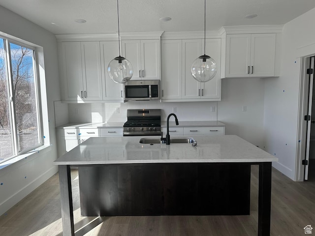 595 W 330 S, American Fork, UT 84003 - kitchen featuring decorative backsplash, a sink, stainless steel appliances, and light wood finished floors