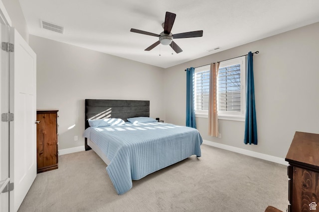 bedroom featuring ceiling fan and light carpet