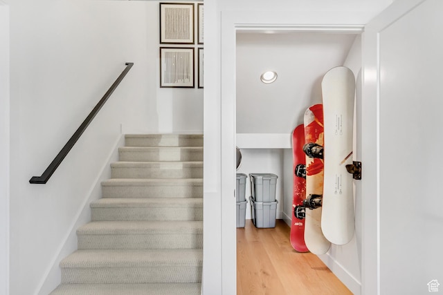 stairs with wood-type flooring
