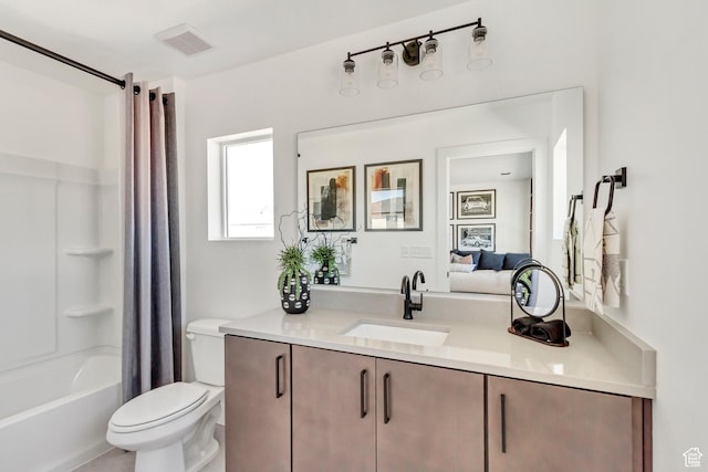 full bathroom with shower / bath combo, toilet, and vanity