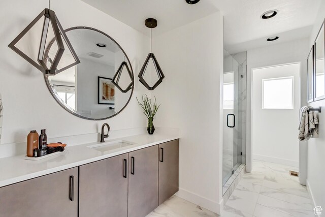 bathroom with walk in shower and vanity