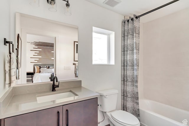 full bathroom featuring toilet, vanity, and shower / bathtub combination with curtain
