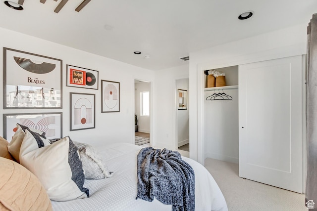 carpeted bedroom with ceiling fan