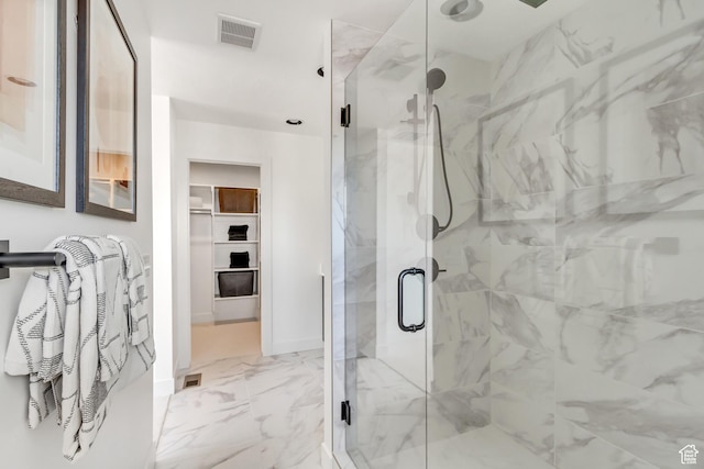 bathroom with a shower with shower door