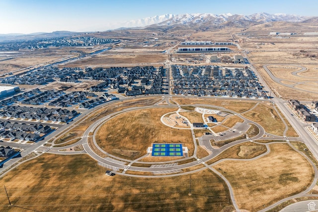 birds eye view of property with a mountain view