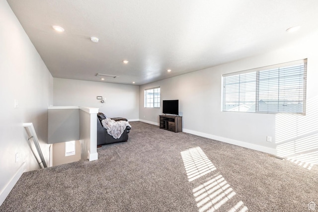 sitting room featuring carpet floors, recessed lighting, an upstairs landing, and baseboards