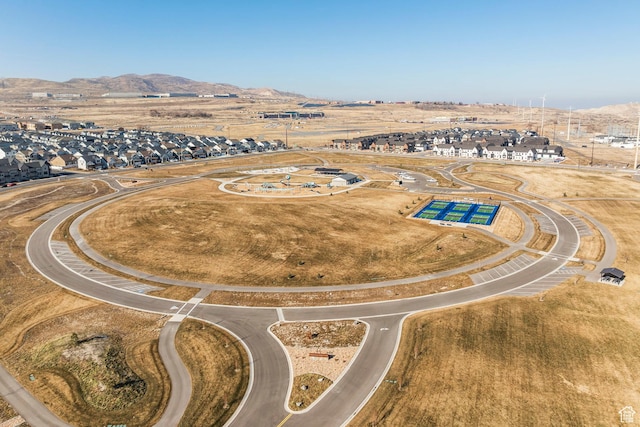 birds eye view of property with a mountain view