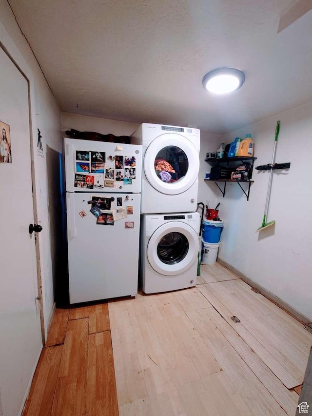 3260 Ogden Ave, Ogden, UT 84401 - laundry area with light hardwood / wood-style floors and stacked washer / dryer