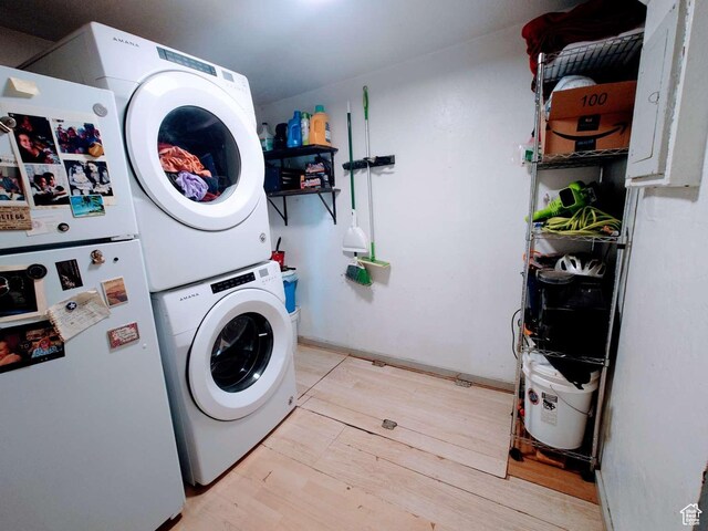 3260 Ogden Ave, Ogden, UT 84401 - clothes washing area featuring stacked washing maching and dryer
