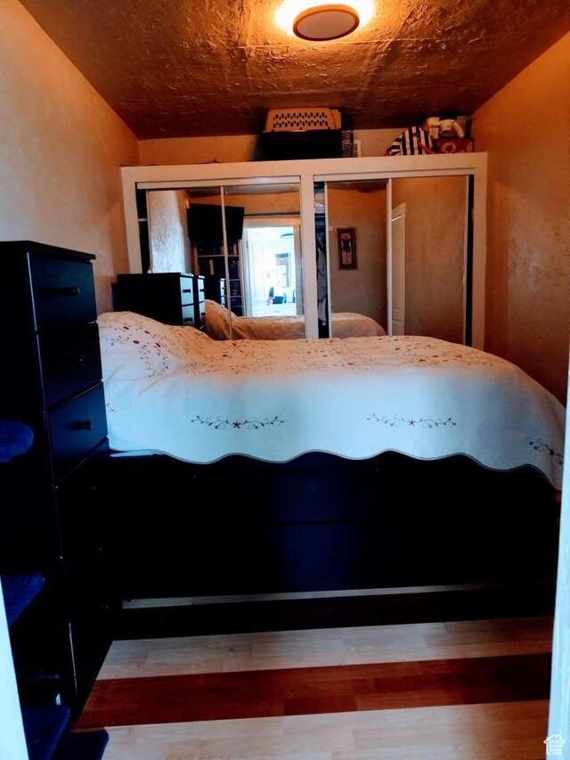 3260 Ogden Ave, Ogden, UT 84401 - unfurnished bedroom featuring hardwood / wood-style floors and vaulted ceiling