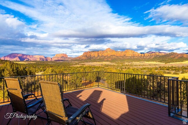 wooden deck featuring a mountain view