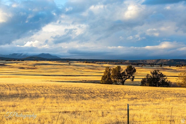 mountain view featuring a rural view