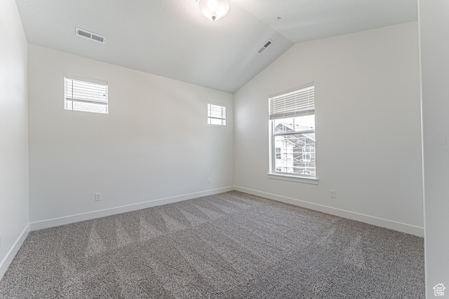 13742 S Hanley Ln Unit Gg303, Riverton, UT 84096 - empty room featuring healthy amount of natural light, lofted ceiling, and light colored carpet