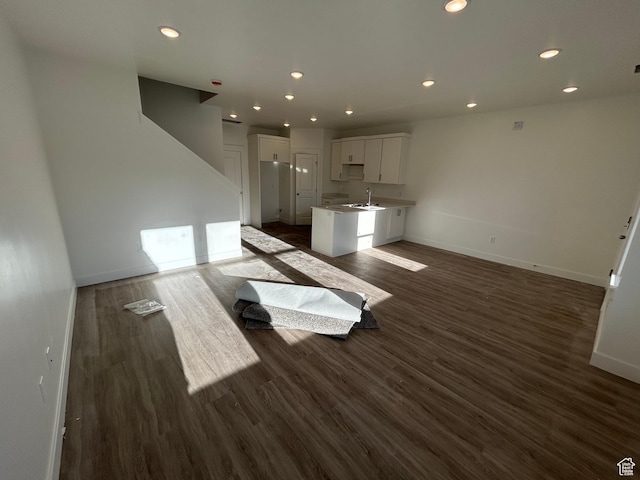 202 W 3175 S Unit T612, Nibley, UT 84321 - unfurnished living room with a sink, baseboards, dark wood-style floors, and recessed lighting