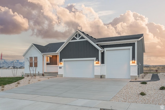 537 W Coyote Ridge Rd, Grantsville, UT 84029 - view of front of home with a mountain view and a garage