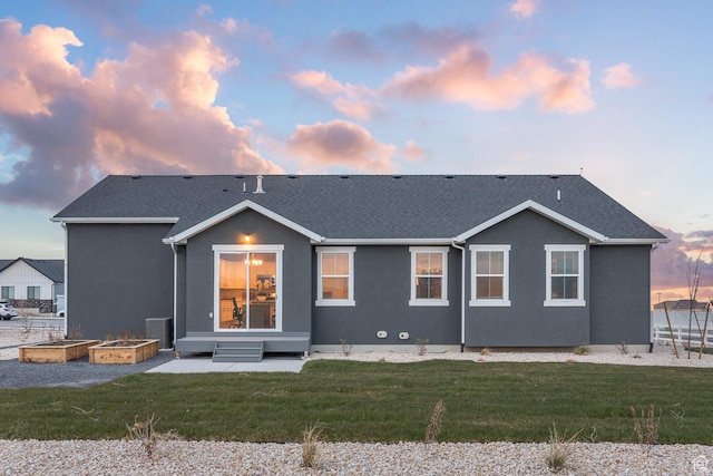 537 W Coyote Ridge Rd, Grantsville, UT 84029 - back house at dusk with a yard