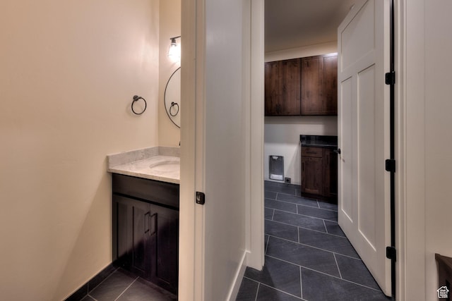 bathroom with tile patterned floors and vanity