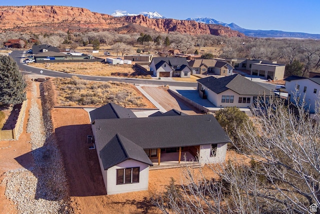 birds eye view of property featuring a mountain view
