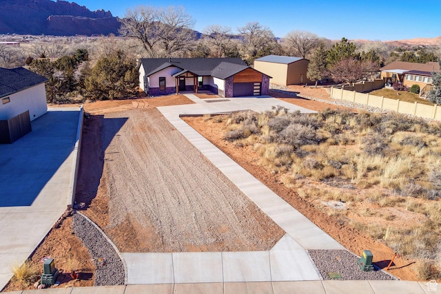 view of front of house with a mountain view and a garage