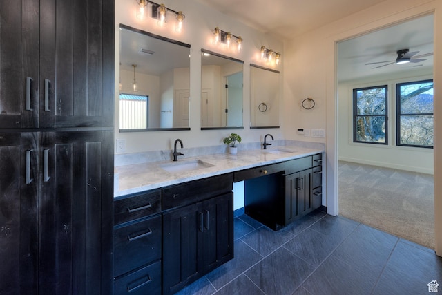 bathroom with ceiling fan, vanity, and tile patterned flooring