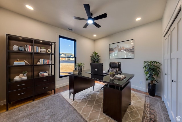 office space with ceiling fan