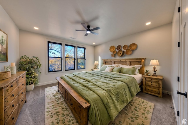 bedroom featuring light colored carpet and ceiling fan
