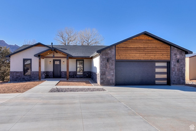 view of front facade with a mountain view and a garage