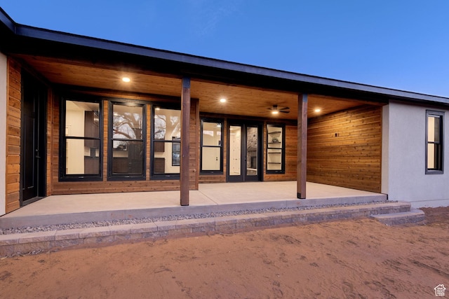 back of property with a patio