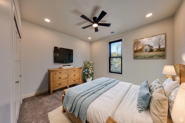 bedroom with dark carpet and ceiling fan
