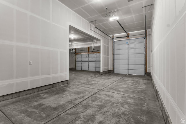727 W Cherry Unit 214, Grantsville, UT 84029 - garage featuring a garage door opener