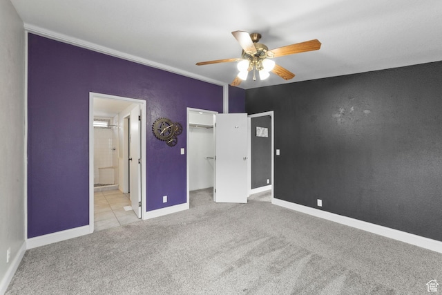 112 Arbor Dr, Moab, UT 84532 - unfurnished bedroom featuring a closet, light colored carpet, connected bathroom, and ceiling fan