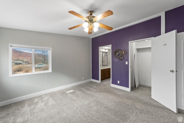 112 Arbor Dr, Moab, UT 84532 - unfurnished bedroom with ceiling fan, light colored carpet, connected bathroom, and a closet