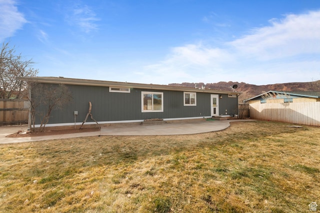 112 Arbor Dr, Moab, UT 84532 - back of property with a lawn and a patio