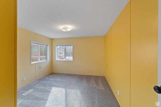 112 Arbor Dr, Moab, UT 84532 - empty room with carpet flooring and a textured ceiling