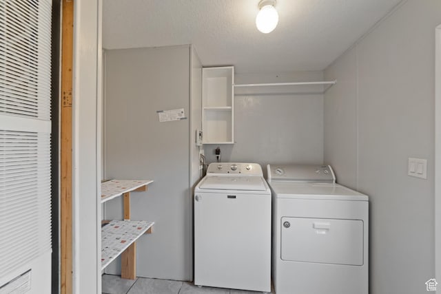 112 Arbor Dr, Moab, UT 84532 - washroom with a textured ceiling, light tile patterned floors, and washing machine and dryer