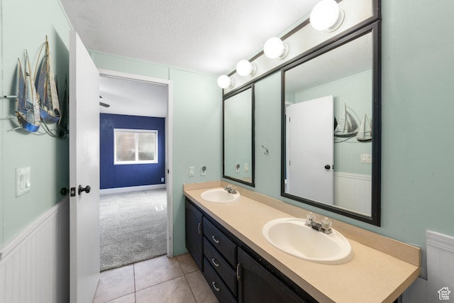 112 Arbor Dr, Moab, UT 84532 - bathroom with a textured ceiling, vanity, and tile patterned flooring