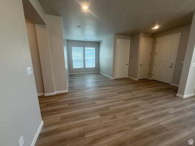 6158 W 11800 S Unit 504, South Jordan, UT 84009 - spare room with light wood finished floors and recessed lighting