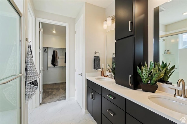6158 W 11800 S Unit 504, South Jordan, UT 84009 - bathroom with double vanity, a shower stall, a spacious closet, and marble finish flooring