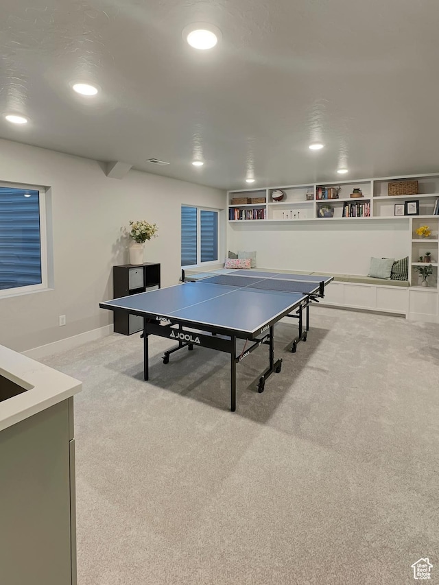 playroom featuring recessed lighting, light carpet, and baseboards