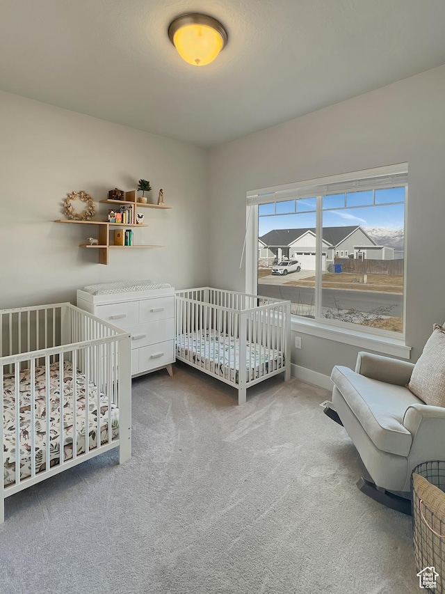 bedroom with carpet floors and baseboards