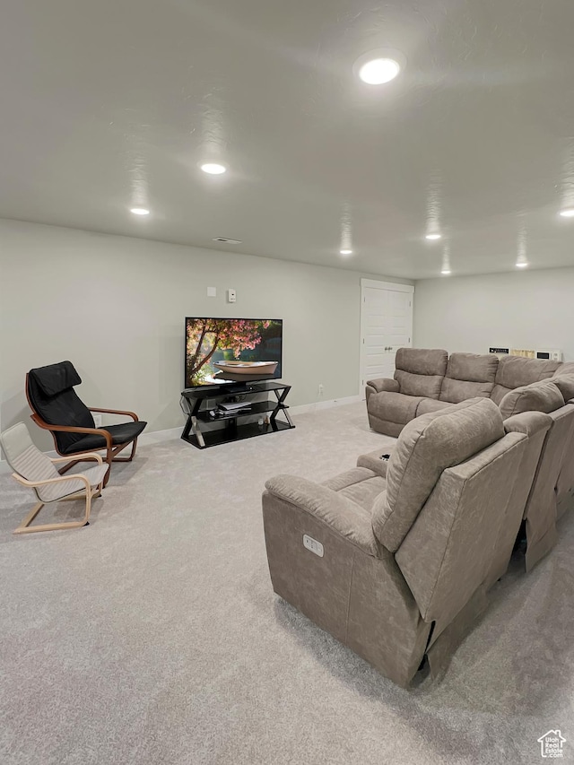 living area featuring recessed lighting, light carpet, and baseboards