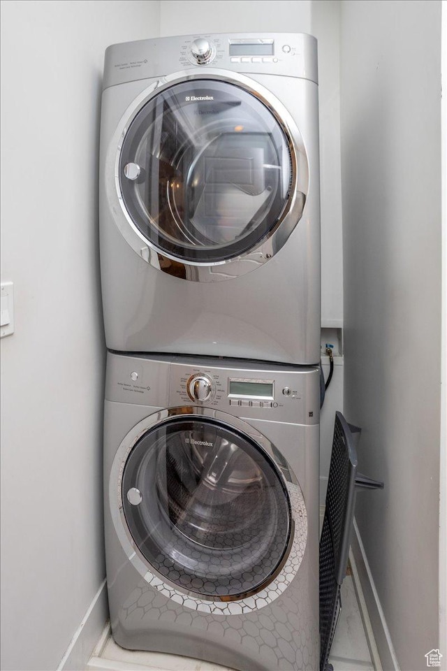 2025 W Orchard Harvest Dr, Kaysville, UT 84037 - washroom with stacked washer / dryer and tile patterned floors