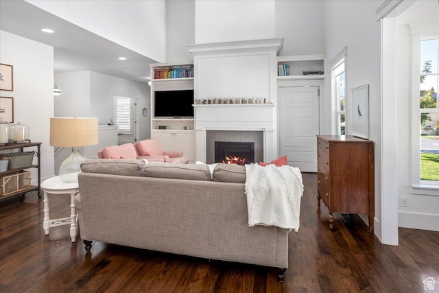 2025 W Orchard Harvest Dr, Kaysville, UT 84037 - living room with a wealth of natural light, a tile fireplace, and dark wood-type flooring