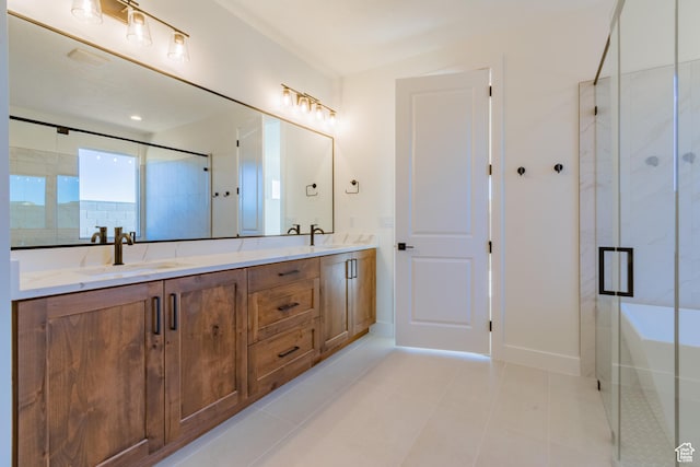 bathroom with vanity, tile patterned floors, and a shower with door