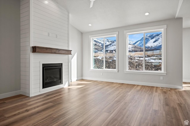 354 S 1150 E Unit 605, Smithfield, UT 84335 - unfurnished living room with baseboards, recessed lighting, wood finished floors, and a large fireplace