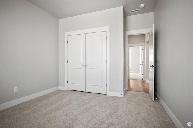 354 S 1150 E Unit 605, Smithfield, UT 84335 - unfurnished bedroom with carpet flooring, a closet, visible vents, and baseboards